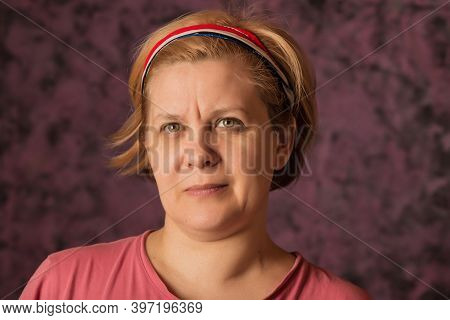 Woman's Portrait On The Abstract Background.