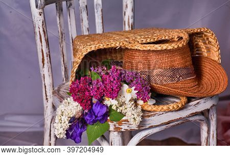 Stillife With Lilak Flowers And Hat On Vintaje Cher