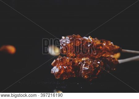 Candy Cane Sugar, Brown Sugar Sticks On A Dark Table, Selective Focus