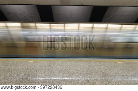 Motin Blured Metro Moving In A Station