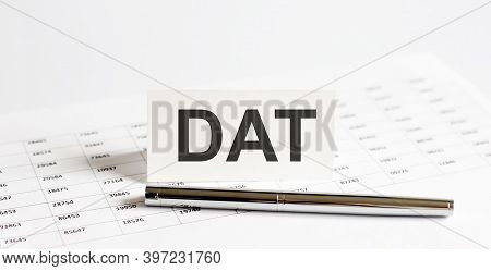 Text Dat On Stickers,pen On The Background Of Documents. Financial Bookkeeping, Accounting Concept.