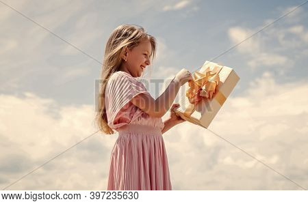 Perfect Day. Holding Gift In Hand. Smiling Little Girl With Shopping Gift. Black Friday Sale. Holida