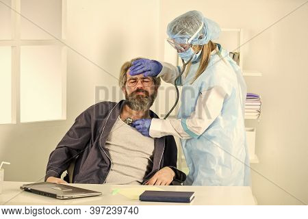 Coronavirus Symptoms. Diagnosis Of Pneumonia. Sars Concept. Doctor Protective Equipment Examines Mal