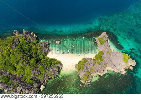 Aerial View Of Small Isolated Tropical Island With White Sandy Beach And Blue Transparent Water And 