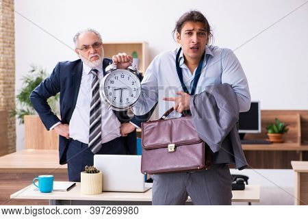 Old boss and his male secretary employee in time management conc