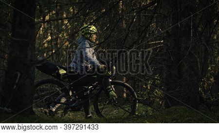 The Woman Travel On Mixed Terrain Cycle Touring With Bike Bikepacking. The Traveler Journey With Bic