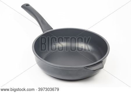 Biack Frying Pan With Non-stick Teflon Coating On White Background