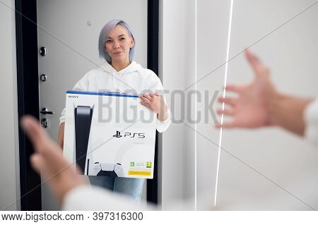 Young Woman Comes Home To Make A Surprise For Her Boyfriend With A Brand New Sony Playstation 5 Gami
