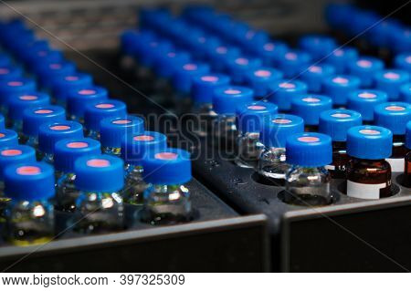 Hplc Glass Vials In The Rack. Research And Development Of Pharmaceuticals And Vaccines. High Perform