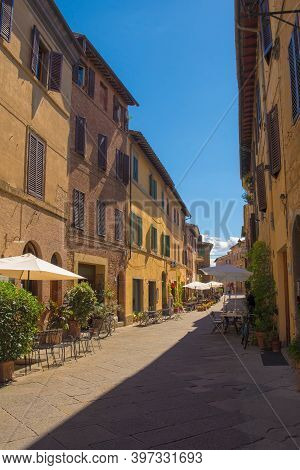 Buonconvento, Italy - September 3rd 2020. A High Street In The Historic Medieval Village Of Buonconv