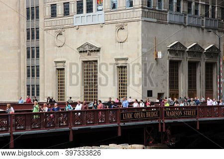 Chicago, Usa - June 26, 2013: People Walk The Lyric Opera Bridge In Chicago. It Is One Of Chicago's 