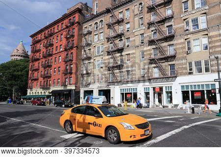 New York - July 2, 2013: People Ride Yellow Taxi In Lower Manhattan In New York. As Of 2012 There We
