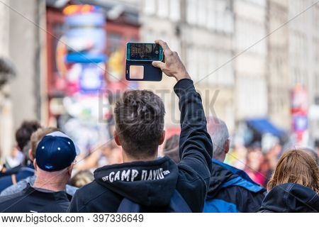 Edinburgh, Scotland, August 8th 2019. Photographer Or Blogger Shooting Photos Or Video, Using Modern