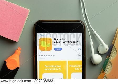 New York, Usa - 1 December 2020: Qinbaobao Mobile App Icon On Phone Screen Top View, Illustrative Ed