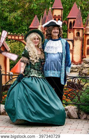 The Man And Women Are Dressed In Antique Clothes And Hats.puppet Museum, July 2020 In Preili, Latvia