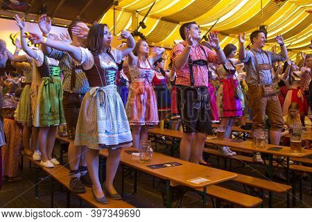Stuttgart, Germany, 25 September 2016. Volksfest In Stuttgart.  People Dance In The Beer Tent.