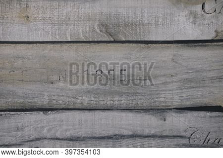 Wooden Texture Of Three Planks With Number 1855 Embrassed On It