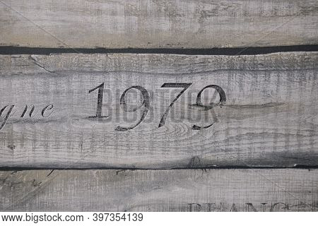 Wooden Texture Of Three Planks With Number 1979 Embrassed On It