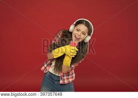 Cleaning Party. Girl Wear Headphones And Protective Gloves For Cleaning. Listening Music And Cleanin