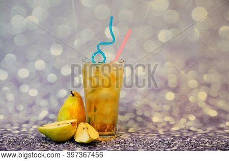 Pear Juice In A Tall Glass With Ice