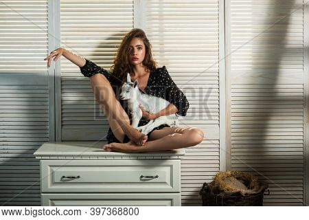Fashion Girl. Young Woman With A Small And Nice Goatling. Girl Plays And Huhs Goatling Yeanling. Ani