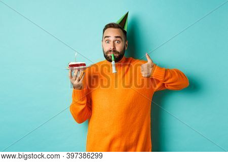 Happy Birthday Guy Celebrating, Wearing Party Hat, Blowing Wistle And Holding Bday Cake And Showing 