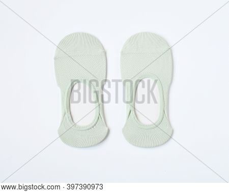 Top View Pair Of Woman Short Sock Or Ankle Sock Or Pile Footsies In Pastel Color On White Background