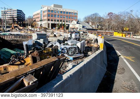 DARIEN,CT, USA-NOVEMBER 29 2020: Construction on bridge on Darien -Stamford border line with Chilton Trust building and The Board Yard BBQ and Grill