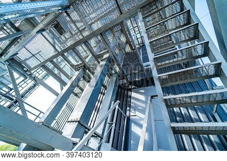 High Metal Frames In The Construction Site. Steel Structure Is Under Construction. Selective Focus.