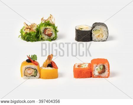 Sushi Maki Rolls. A Set Of Sushi Rolls With Salmon, Shrimp, Tuna Shavings, Chuka Salad, Tobiko Flyin