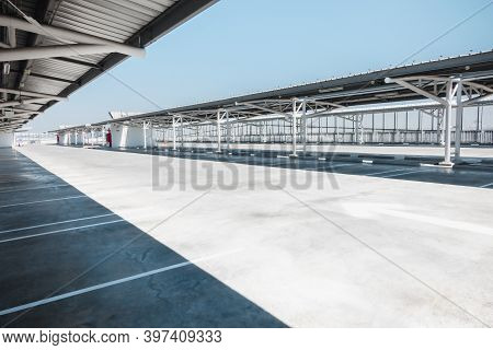 Car Parking Lot Area On Deck Floor Of Shopping Mall, Perspective View Empty Of Car Park Structure Bu