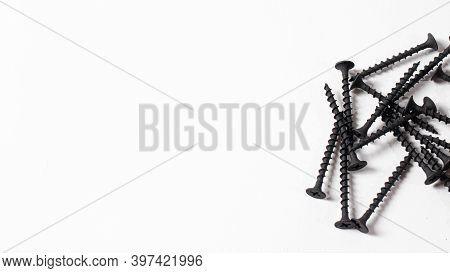 Self-cutters On A White Background Banner With Space For Text. Construction Tools, Self-tapping Scre
