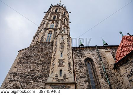 Low Angle View At A Part Of Medieval Stone St. Bartholomew´s Church In Autumn Day, Arched Windows, C