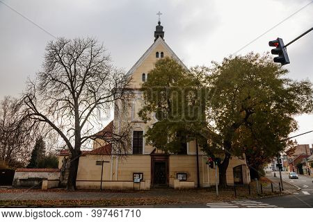 Yellow Baroque Church Of The Holy Trinity In Old Historic Center Of Kolin In Autumn Day, Central Boh
