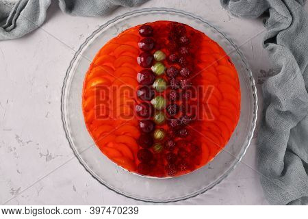 Red Jelly Cake With Fruits And Sour Cream On Gray Background. Flat Lay. View From Above