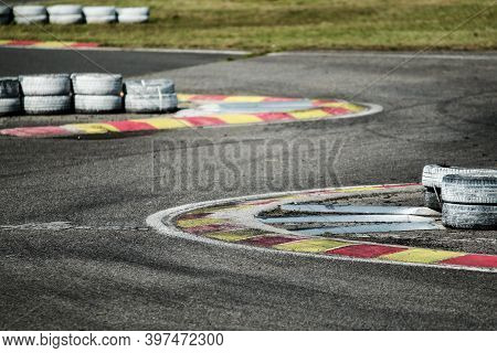 A Detail Picture Of A Part Of The Racetrack. The Chicane With Curbs And Tires Can Be Seen.