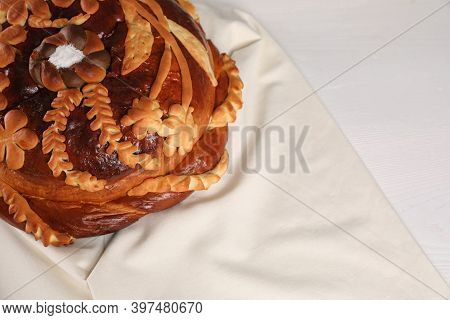 Korovai On White Table, Above View. Ukrainian Bread And Salt Welcoming Tradition