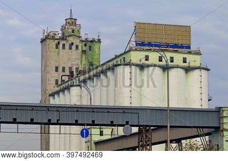 Close-up View Of Old Elevator In Kyiv. Group Of Hoppers For Flour. Industrial Building In Ancient Po