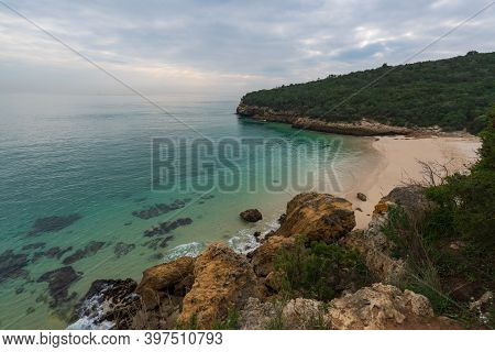 Paradise Idylic Coelhos Beach With Turquoise Water In Arrabida Park, In Portugal