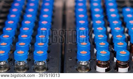 Hplc Glass Vials In The Rack. Research And Development Of Pharmaceuticals And Vaccines. High Perform