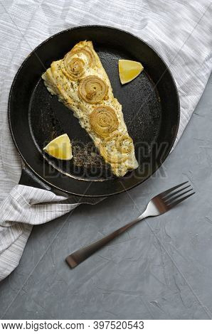 Fried Baked Mackerel Trachurus With Onions And Dried Herbs In An Old Frying Pan In A Towel With A Fo