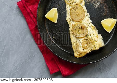 Fried Baked Mackerel Trachurus With Onions And Dried Herbs In An Old Frying Pan. Country Style. Top 