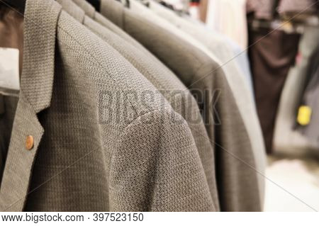 Men Casual Jackets Hang On Coathangers At Showroom