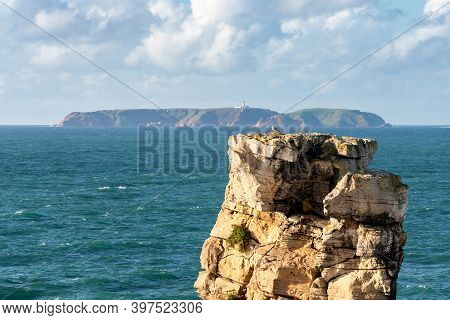 Peniche Sea Cliffs With Berlengas Island On The Background With Atlantic Ocean, In Portugal