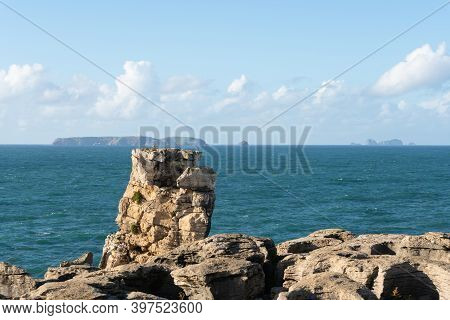 Peniche Sea Cliffs With Berlengas Island On The Background With Atlantic Ocean, In Portugal