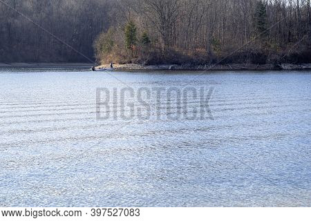 Breautiful Lake View, Gentle Wave Motion On The Cool Blue Water Surface And Sunlight Beaming Into Th