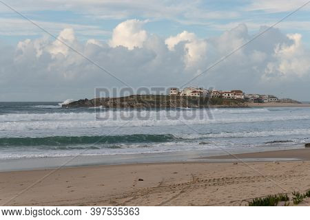 Island Of Baleal Beach And Beautiful Houses With Surfers On The Atlantic Ocean In Peniche, Portugal