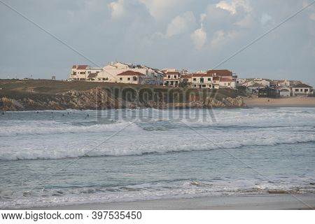 Baleal Island Beach And Beautiful Houses With Surfers On The Atlantic Ocean In Peniche, Portugal