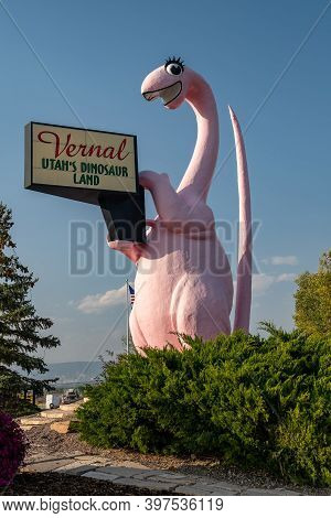 Vernal, Utah - September 24, 2020: Sign For Vernal Utah, With Its Famous Pink Dinosaur Statue, Taken