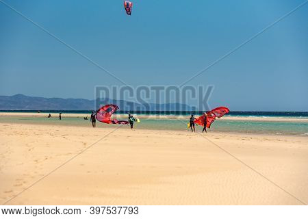 Sotavento, Fuerteventura, Spain: 2020 October 8: Man Practicing Kitesurfing In Playa De Sotavento, F